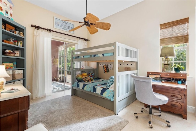 tiled bedroom featuring access to exterior, ceiling fan, and lofted ceiling