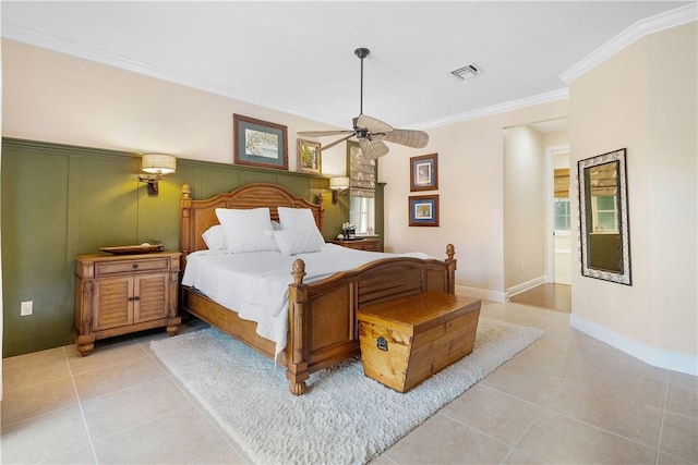 bedroom with light tile patterned floors, ceiling fan, and ornamental molding