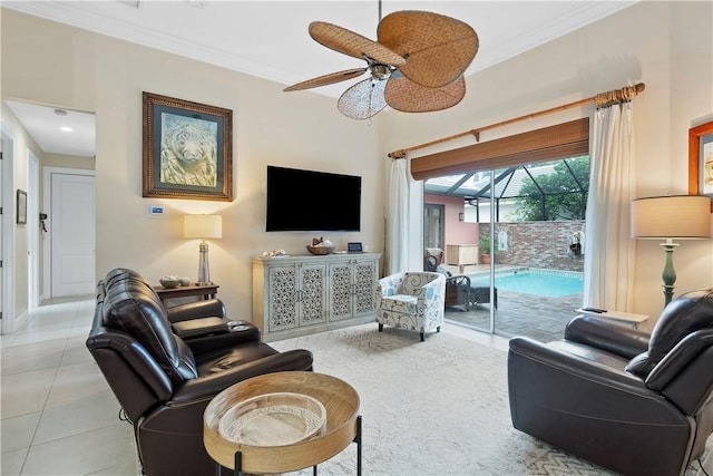 tiled living room with ceiling fan and ornamental molding