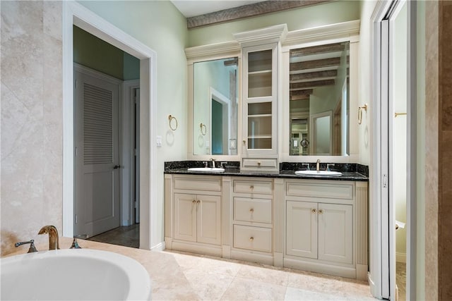 bathroom featuring a bathing tub and vanity