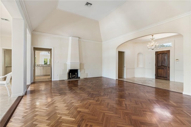 unfurnished living room with crown molding, dark parquet floors, high vaulted ceiling, and a notable chandelier