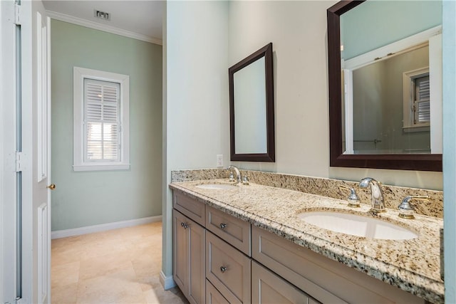 bathroom with vanity and ornamental molding