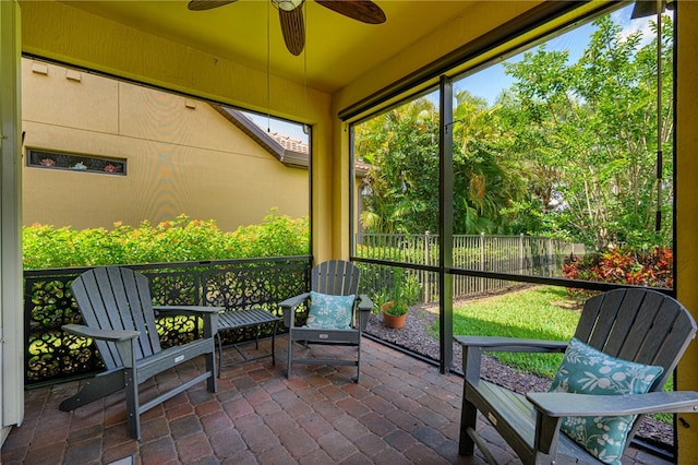 sunroom / solarium with ceiling fan