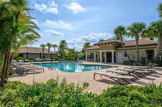 view of swimming pool with a patio area