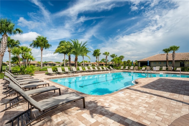 view of swimming pool featuring a patio area