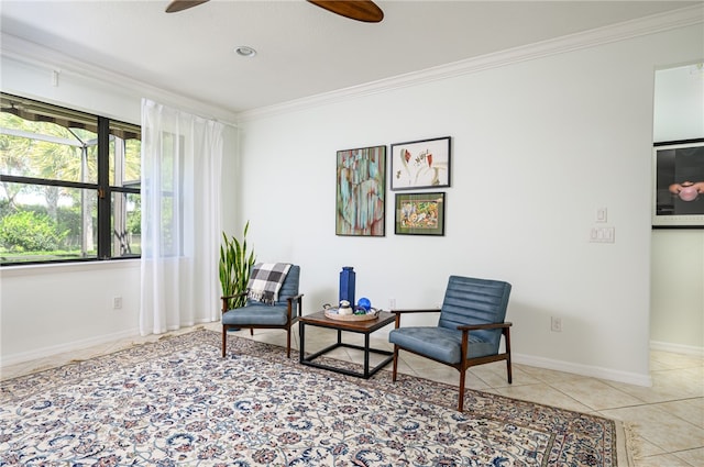 living area with light tile patterned flooring, ceiling fan, and ornamental molding