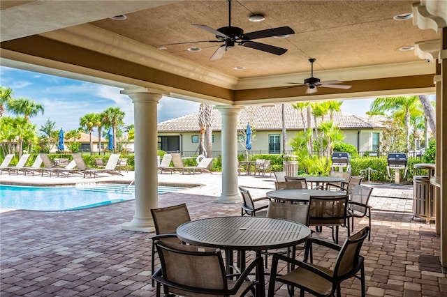 view of patio / terrace featuring a community pool and ceiling fan