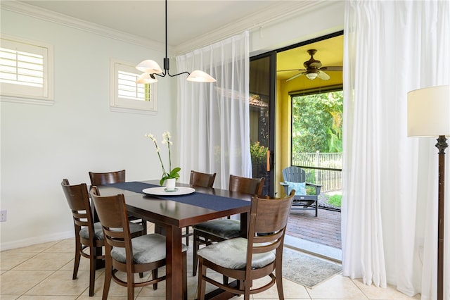 dining room featuring a wealth of natural light, ceiling fan with notable chandelier, and light tile patterned floors