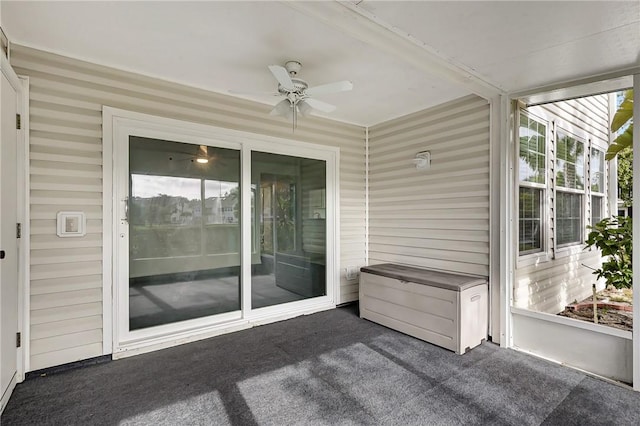 sunroom / solarium featuring ceiling fan