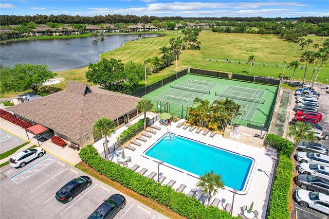 birds eye view of property featuring a water view