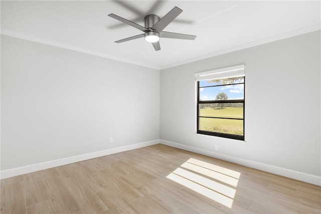 spare room featuring crown molding, ceiling fan, and light hardwood / wood-style floors