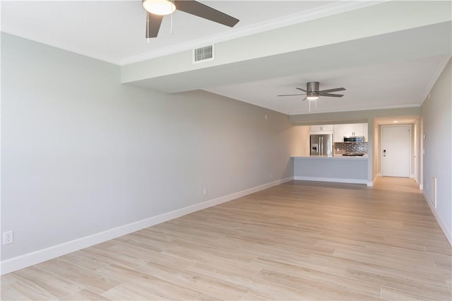 unfurnished living room featuring ceiling fan, ornamental molding, and light wood-type flooring