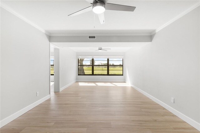 hall with light hardwood / wood-style flooring and ornamental molding