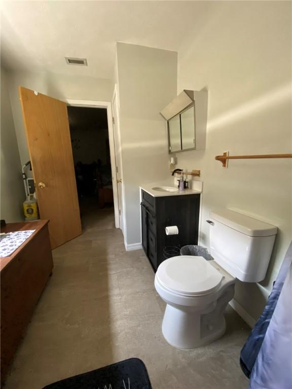 10595 88th St, Vero Beach, FL 32967 - bathroom featuring vanity and toilet