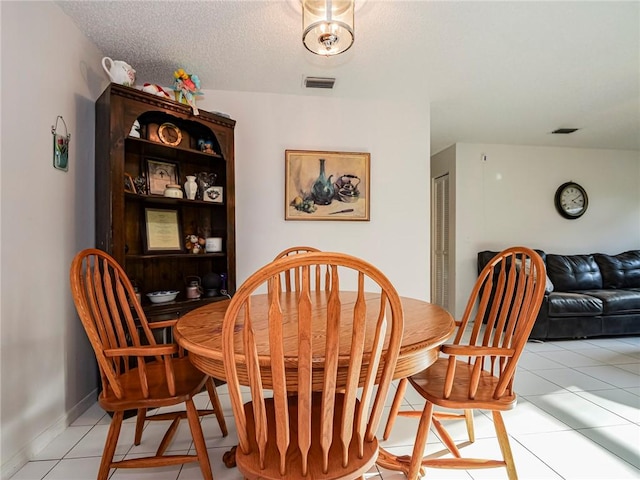 113 Larchmont Ter, Sebastian, FL 32958 - dining area with light tile patterned floors and baseboards