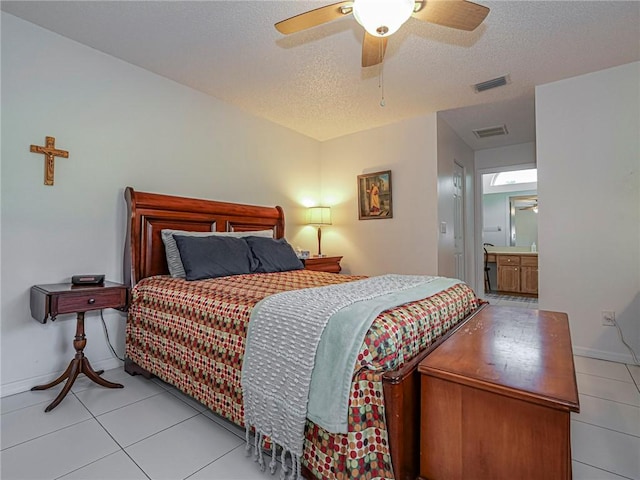 113 Larchmont Ter, Sebastian, FL 32958 - bedroom with tile patterned floors, a textured ceiling, baseboards, and a ceiling fan