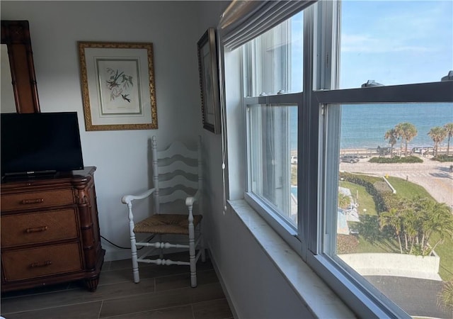 sitting room featuring a water view