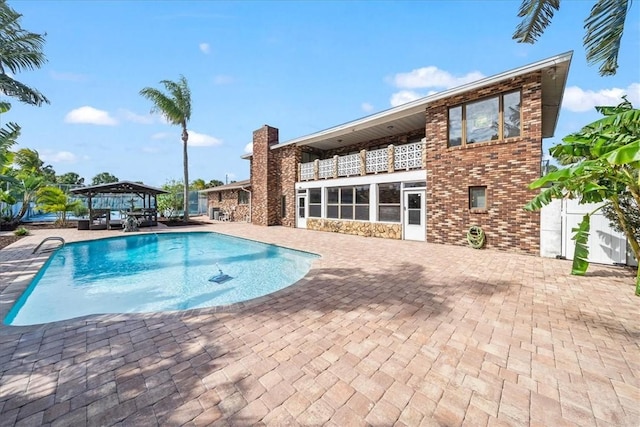 swimming pool featuring a patio area