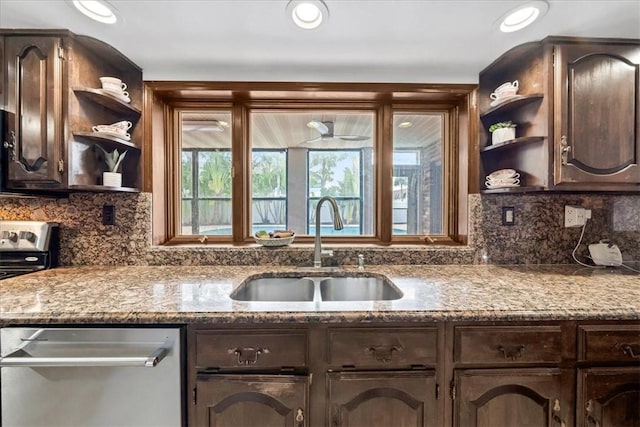 kitchen featuring open shelves, a sink, appliances with stainless steel finishes, and dark brown cabinetry