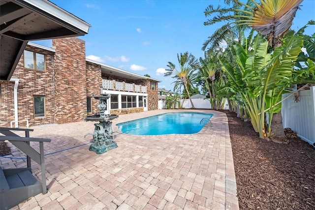 view of pool featuring a patio and a fenced backyard