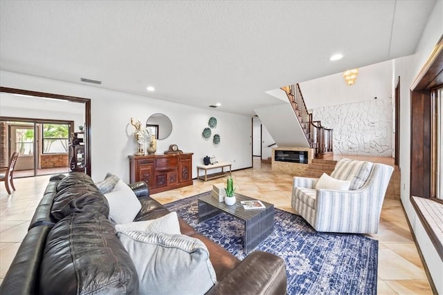 living area with stairway, light tile patterned flooring, and recessed lighting