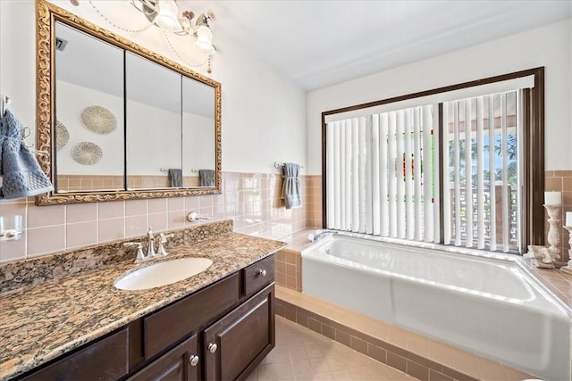 full bathroom with a bath and vanity