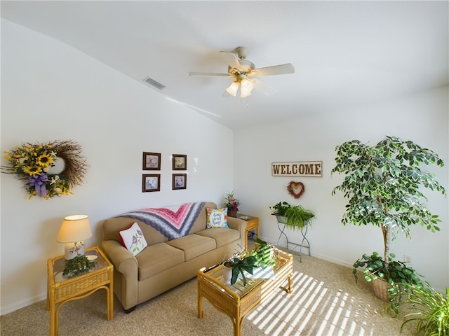 carpeted living room with ceiling fan and lofted ceiling