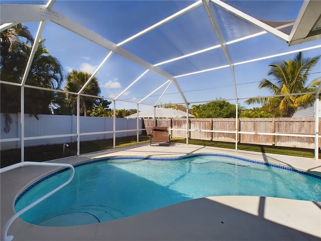 view of pool featuring a patio area and a lanai