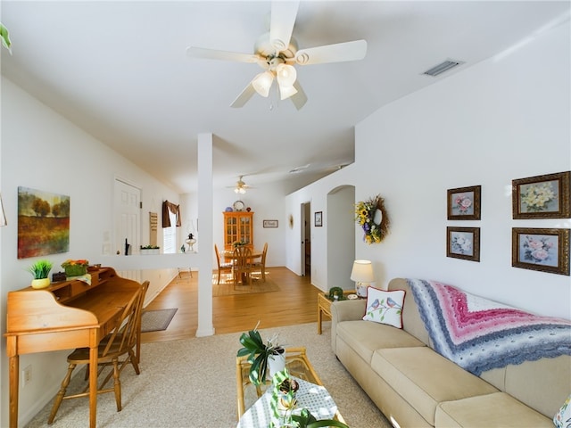 living room featuring ceiling fan and light carpet