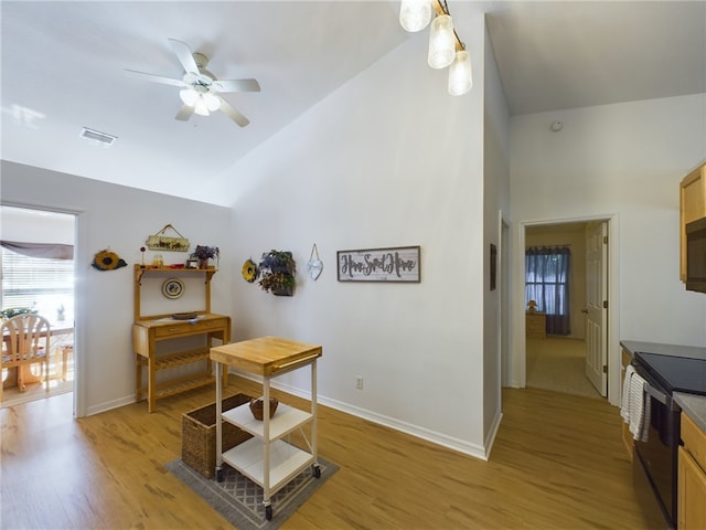 interior space with light hardwood / wood-style flooring and lofted ceiling