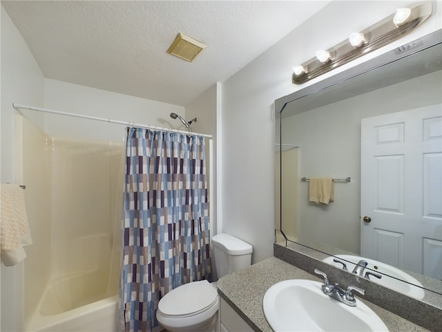 full bathroom featuring vanity, toilet, shower / tub combo, and a textured ceiling