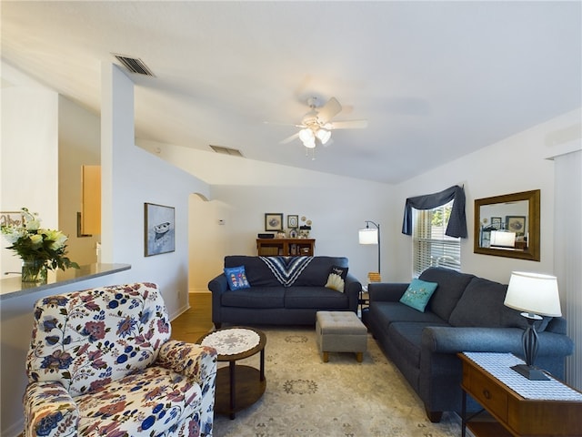 living room with light hardwood / wood-style flooring and ceiling fan