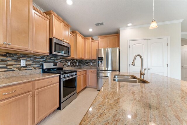 kitchen with stainless steel appliances, wine cooler, sink, light brown cabinetry, and pendant lighting