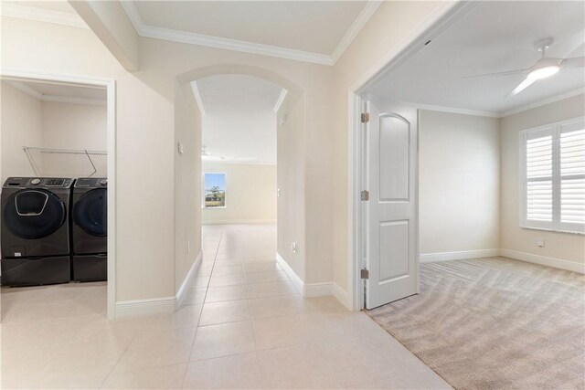 hall with light tile patterned floors and ornamental molding