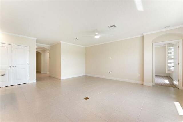 tiled living room featuring ceiling fan with notable chandelier and crown molding