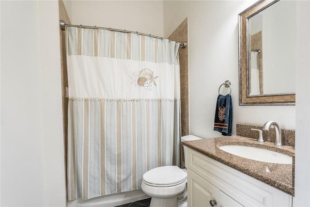 full bath featuring vanity, curtained shower, and toilet