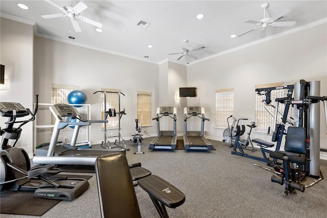 gym featuring a ceiling fan, baseboards, visible vents, and ornamental molding