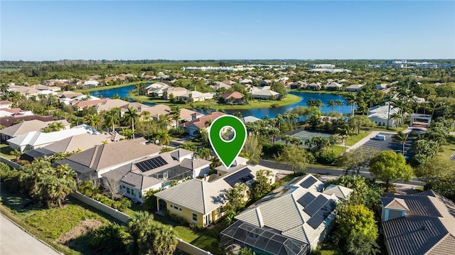 birds eye view of property featuring a residential view and a water view