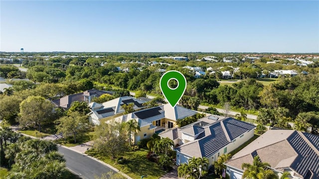 birds eye view of property with a residential view