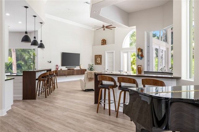 540 Marbrisa Dr, Vero Beach, FL 32963 - dining space featuring plenty of natural light, a high ceiling, and light wood-type flooring