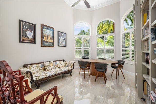 540 Marbrisa Dr, Vero Beach, FL 32963 - interior space featuring a high ceiling, a ceiling fan, baseboards, and ornamental molding