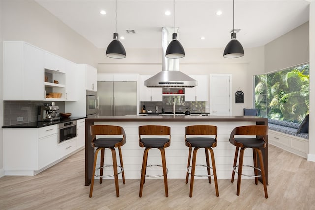 540 Marbrisa Dr, Vero Beach, FL 32963 - kitchen with visible vents, decorative backsplash, oven, and stainless steel built in fridge