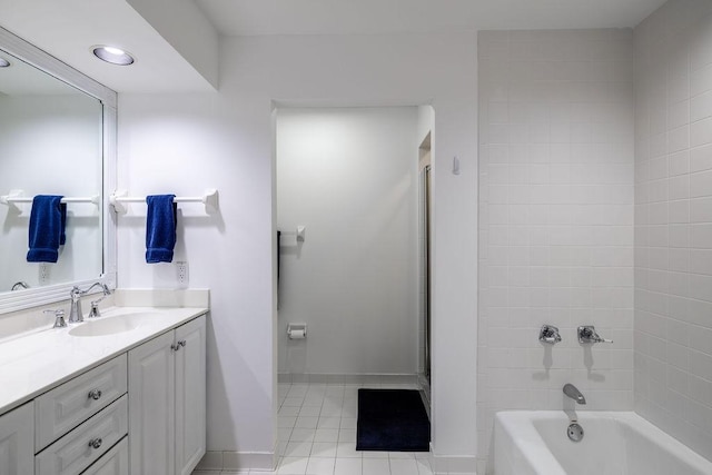 full bath featuring tile patterned floors, recessed lighting,  shower combination, baseboards, and vanity