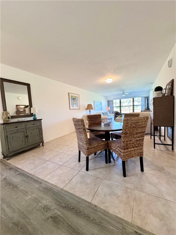 dining area with light tile patterned floors