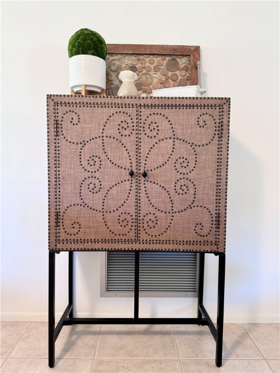 interior details featuring tile patterned floors