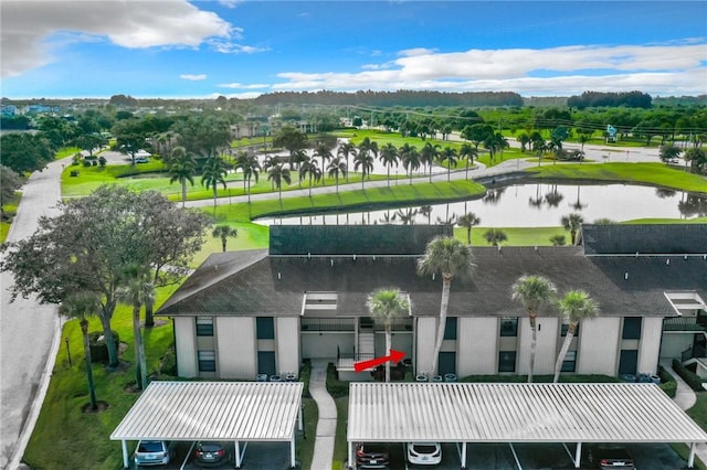 birds eye view of property with a water view