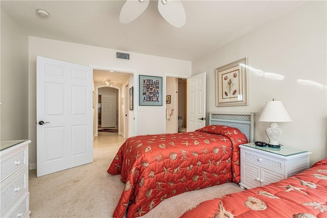 bedroom with ceiling fan and light carpet