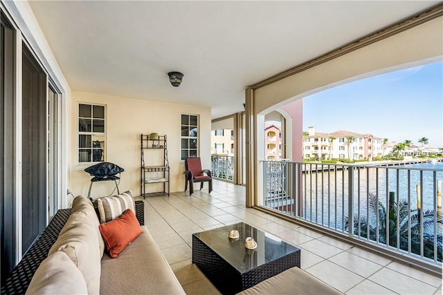 balcony featuring a water view