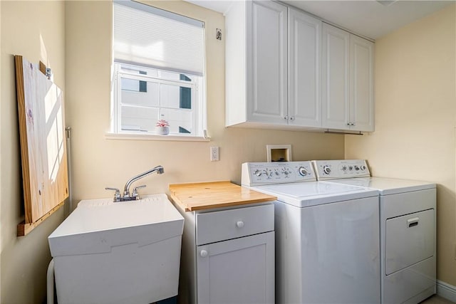 washroom with cabinets and independent washer and dryer