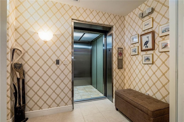 bathroom with tile patterned floors and elevator